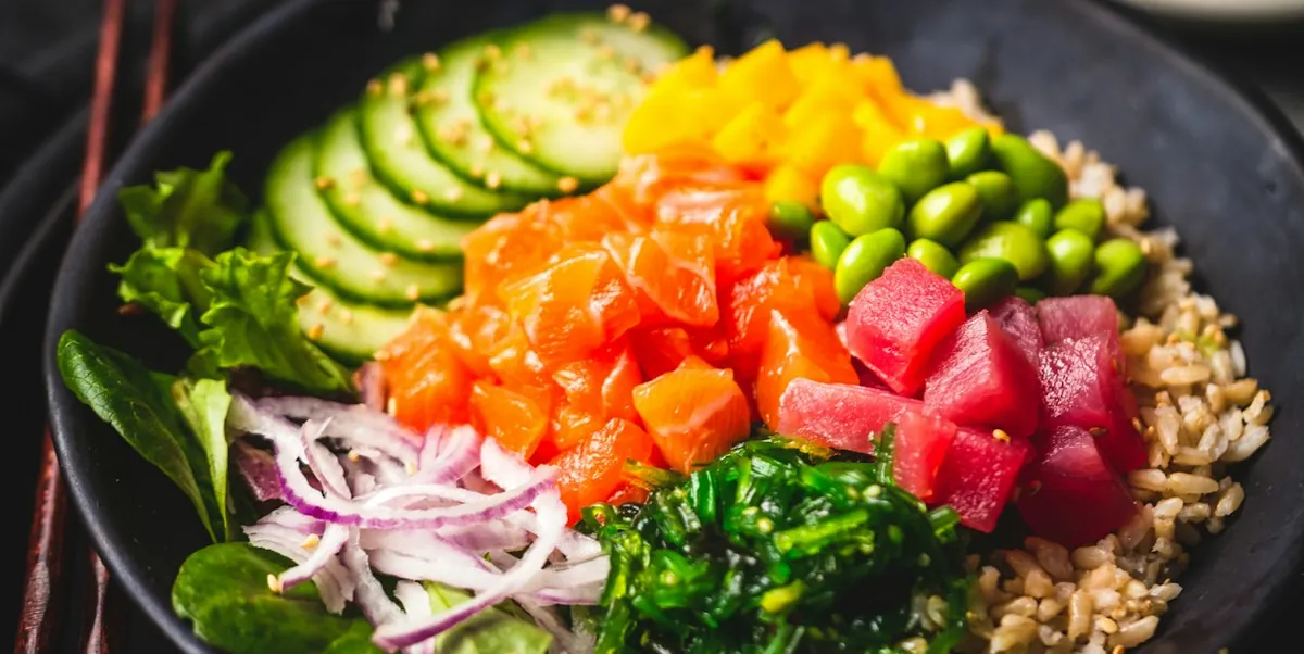 Poke bowl with tuna, salmon, avocado and mango